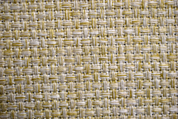 Yellow carpet fabric background close-up with threads