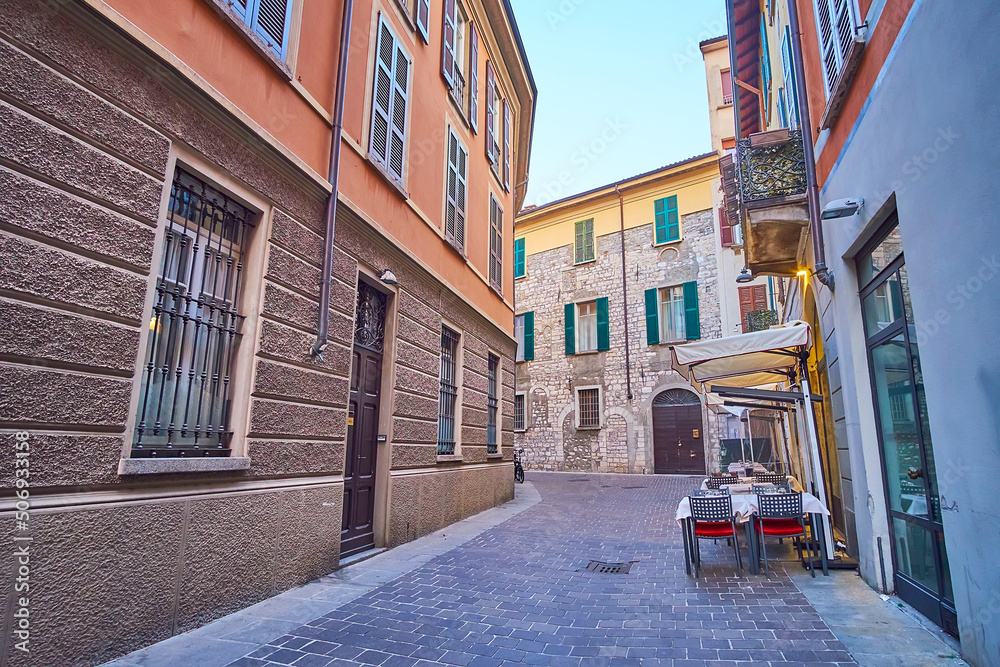 Canvas Prints The narrow Via Bonanomi with tourist restaurant, Como, Italy