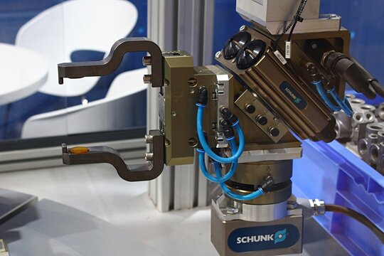 Industrial robotic arm with gripper and sensors, displayed by German manufacturer Schunk on International Engineering Fair in Nitra, Slovakia