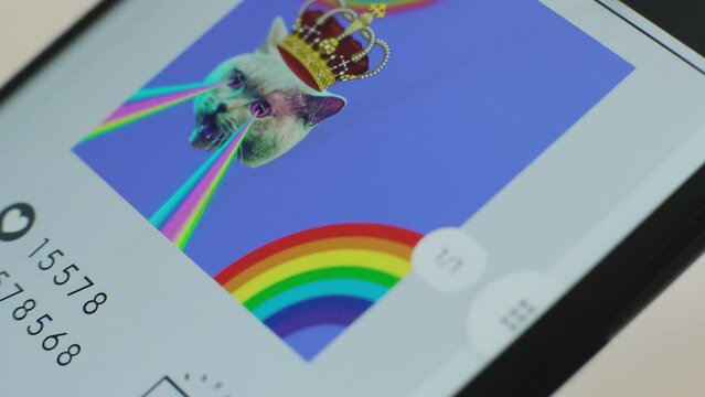 Macro of NFT Marketplace on Mobile Phone Screen. Website For Selling and Buying Digital Art on NFT Marketplace Using non-fungible Token with Cryptographic Encryption. Modern Art In Blockchain Tech.
