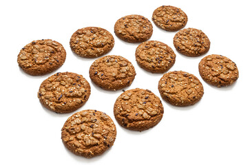Oatmeal cookies lie in rows on a white background