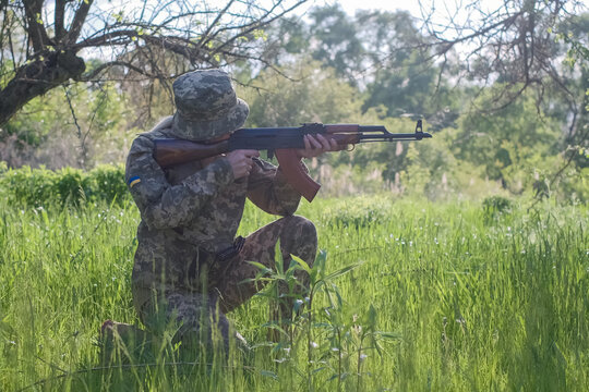 Ukrainian Female Soldier Armed With An Assault Rifle Patrols A Combat Zone