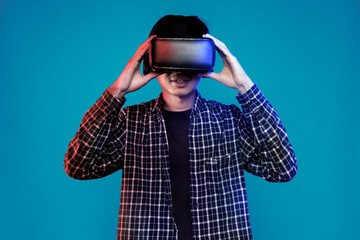 Young man having virtual reality experience using vr headset