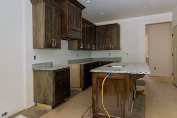 Kitchen furniture set installation in hanging cabinet for new house