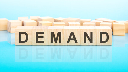 word demand made with wood building blocks, business concept