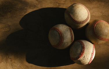Grunge baseballs on wood background for old ball equipment. 