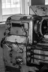  Metalworking workshop, metal processing machines.  Vintage Industrial Machinery in a old factory - black and white photo