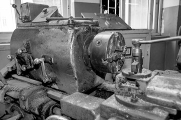  Metalworking workshop, metal processing machines.  Vintage Industrial Machinery in a old factory - black and white photo