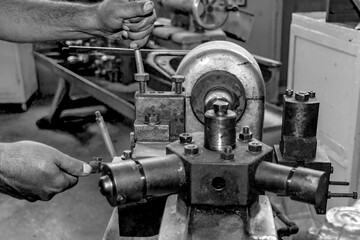  Metalworking workshop, metal processing machines.  Vintage Industrial Machinery in a old factory - black and white photo