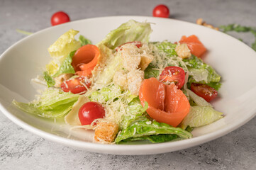 Fresh salad with leaves and red fish