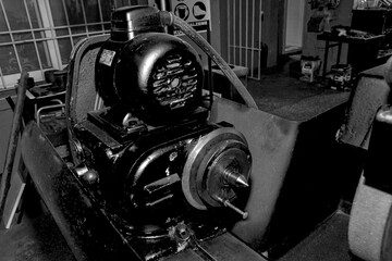  Metalworking workshop, metal processing machines.  Vintage Industrial Machinery in a old factory - black and white photo