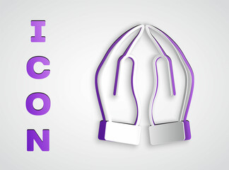 Paper cut Hands in praying position icon isolated on grey background. Prayer to god with faith and hope. Paper art style. Vector