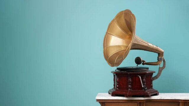 4K Video. Old vintage gramophone playing a vinyl on an isolated background.