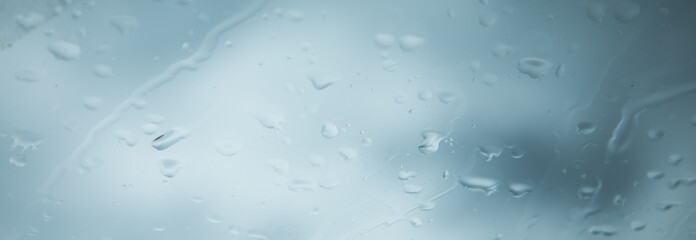 Raindrops on the glass in rainy weather