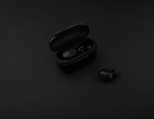Wireless headphones. High quality headphones on a black background. Headphone product photo.