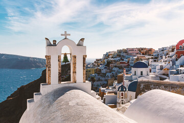 Santorini famous view with white houses and churches.