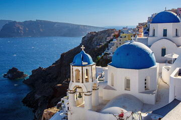 Vacation on Santorini island, Travel to Greece. The blue dome of the white church near the sea and...