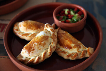 Puff pastries (Turkish: Pogaca) with salad in the plate.