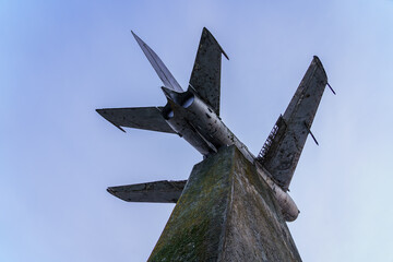 Monument to an old retro vintage airplane. Background with copy space