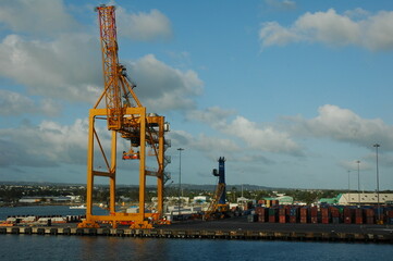 Fototapeta na wymiar Large cargo crane for ships on island