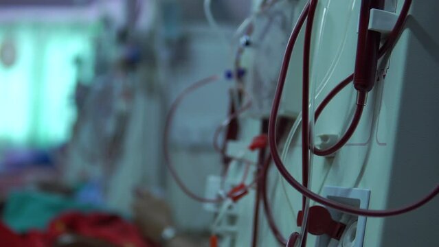 Close up doctor hand uses a dialysis machine for the patient