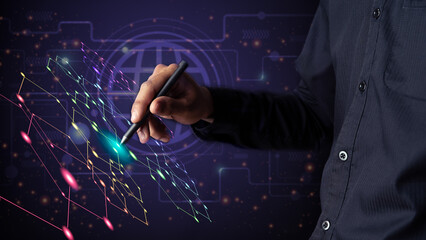 Young businessman holding a pen to manage information systems © chaylek