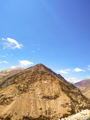 Scenery of the  mountain on blue sky with clouds