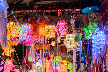 Fototapeta premium Chistmas sale of goods at iluminated shop of New Market at esplanade area in the evening. It is one of the oldest and busiest markets in Kolkata.