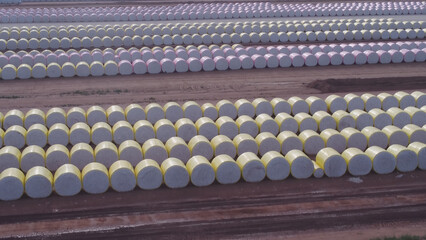 aerial view of rows of cotton bales to be processed by a cotton gin