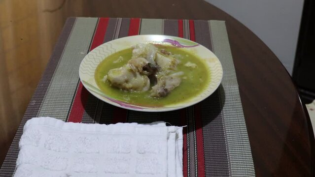 typical dish, homemade food, meat in green sauce, freshly served food, hot food, table served with tablecloth and napkin