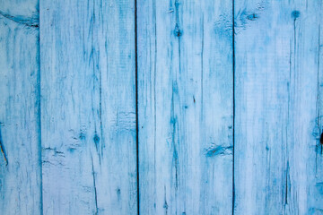 Wooden boards with blue paint.