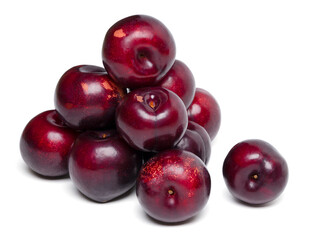 Fresh red plums fruit on white background.