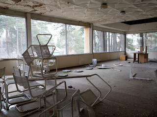 Interior of ruined, abandoned administrative, residential building. The ruins of an abandoned destroyed house. As depressive background for thrash design
