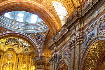 Fototapeta na wymiar Ceiling with gold leaf and bas relief decorations in the Church of La Compania in the Old Town, Quito, Ecuador