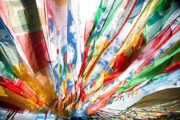 Buddhist prayer flags and tourist attractions in the famous plateau and mountainous areas of China's Tibet Autonomous Region © Guobiao Qiu