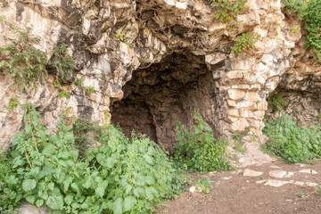 Fototapeta premium The remains of the buildings of the ancient settlement on Mount Arbel, located on the coast of Lake Kinneret - the Sea of Galilee, near the city of Tiberias, in northern Israel