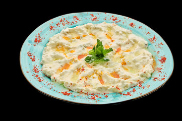 Ali nazik vegetarian salad on a black isolated background, A snack of Middle Eastern cuisine