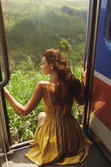 Travel and exploration of tourist woman by train to famous landmarks in Sri Lanka. Touristic...