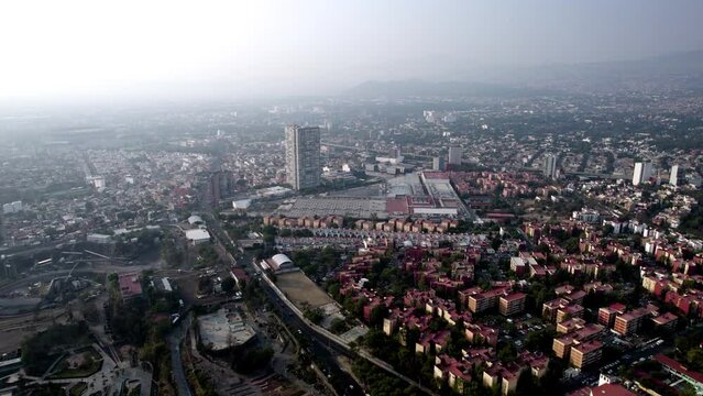 drone video of the south of mexico city during a day with highly polluted air