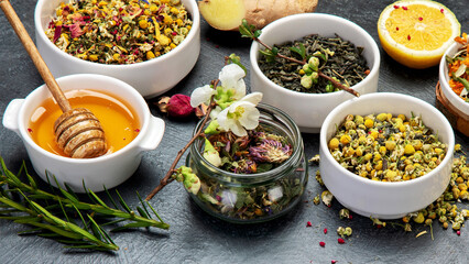 Herbal tea assortment on dark background.