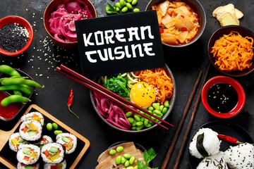 Assortment of Korean food on dark background.