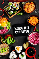 Assortment of Korean food on dark background.