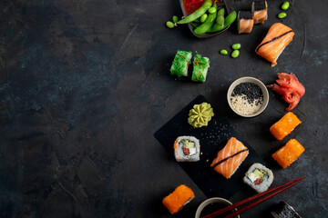 Sushi assortment on dark background.