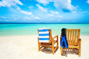 Couple of   wooden chair standing on a beach Indian Ocean.