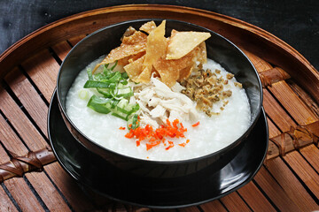 Bubur ayam or Chicken Porridge, Indonesian traditional food consist of white rice porridge,...