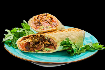 Delicious beef shawarma in cheese pita bread on a black isolated background