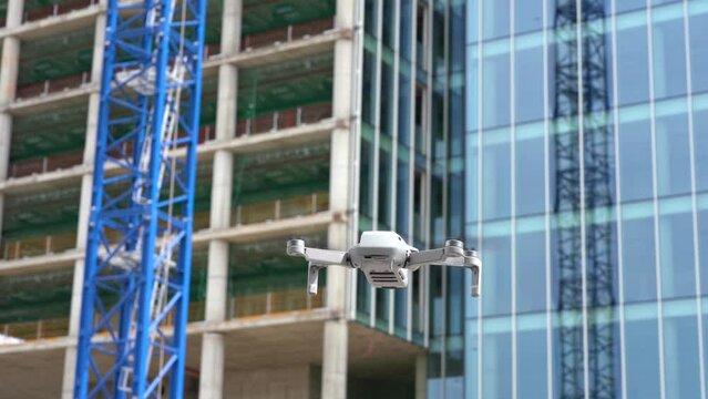 use the drone for surveys and measurements to create a 3d virtual reality model of the building -  the drone in construction site works -  new technology and real estate video and photo