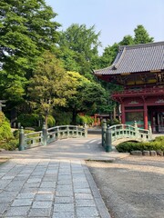 Ancient bridge that leads to the pagoda of Japanese shrine “Nezu”, downtown Tokyo year 2022 May 20th