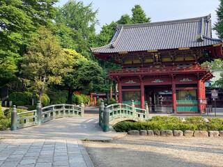 Ancient bridge that leads to the pagoda of Japanese shrine “Nezu”, downtown Tokyo year 2022 May 20th