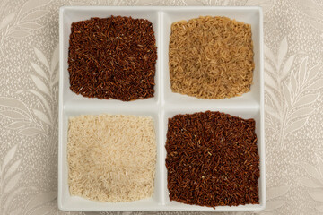 Raw red, brown and white rice